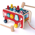Red elephant wooden pounding bench toy with colorful pegs, gear spinners and two wooden mallets on white background