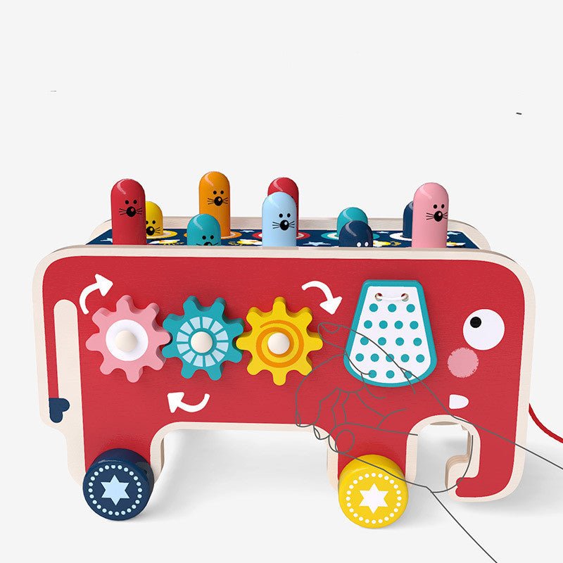 Close-up of elephant pounding bench side panel showing spinning gear activity and lacing bead features
