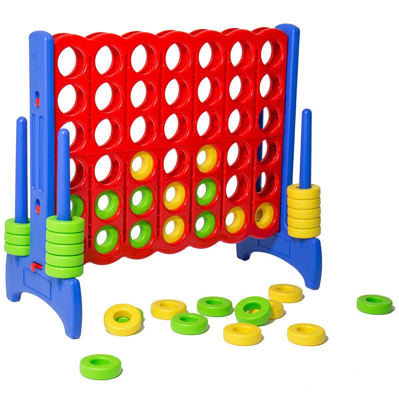 Giant connect four game set on white background with green and yellow rings scattered on floor
