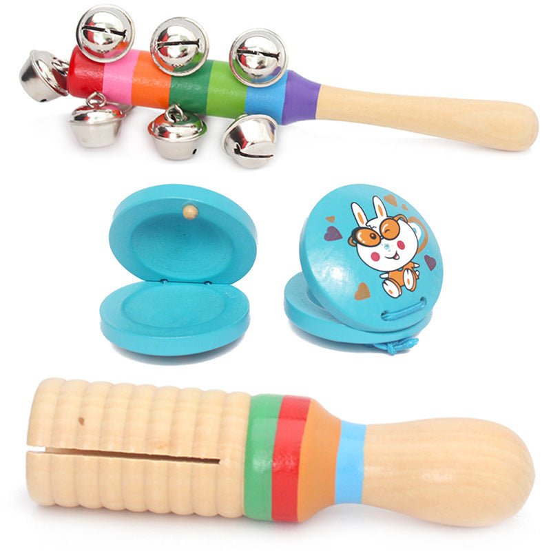 ndividual pieces from wooden baby musical set including rainbow bell stick, castanets and guiro rattle